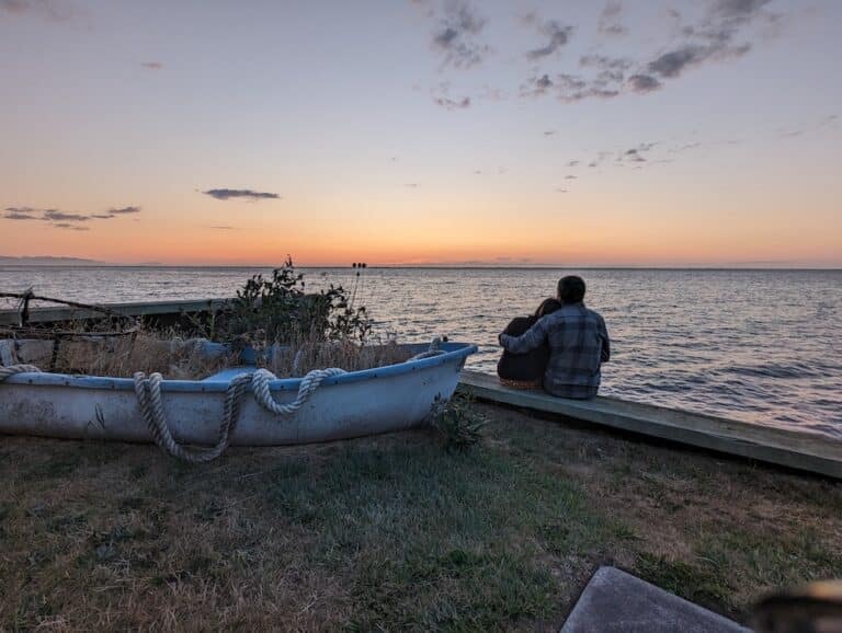 Couple on our private beach enjoying one of the best weekend getaways from Seattle